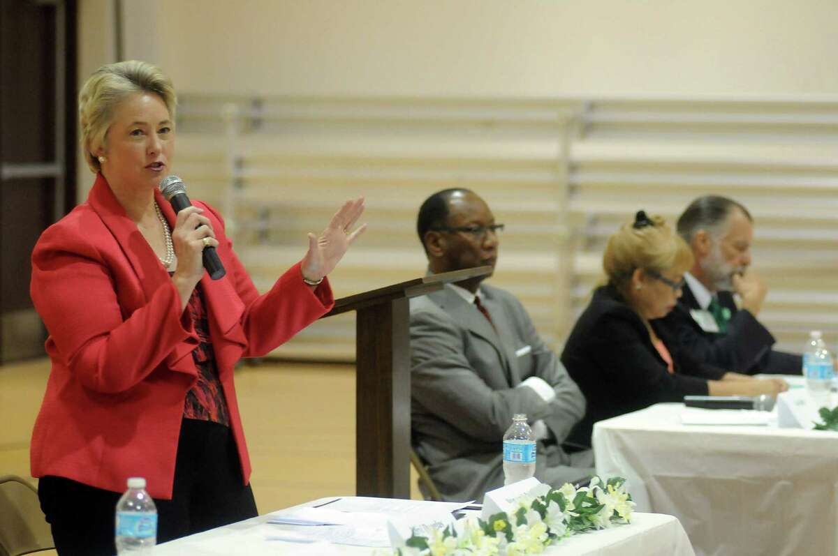 Mayor Annise Parker and Ben Hall appear at a political event sponsored by the Baptist Ministers Association of Houston at the J.J. Roberson Family Life Center.