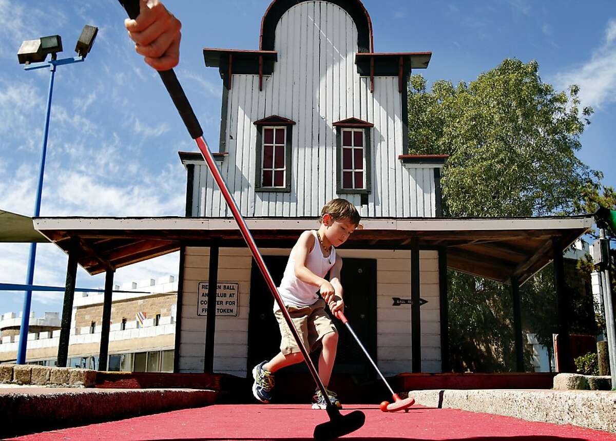 Niko Lukeziz, 5, of Brisbane, plays his final hole at Malibu Grand Prix in Redwood City, Calif., Friday, August 16, 2013. The amusement center is closing its doors after 35 years of operation.