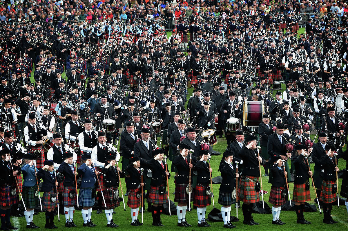 Mass pipe bands gather for the prize giving during the 2013 World Pipe Band Championships at Glasgow Green on August 18, 2013 in Glasgow, Scotland. The annual World Pipe Band Championships has returned to Glasgow this weekend, with 225 pipe bands competing for the title.