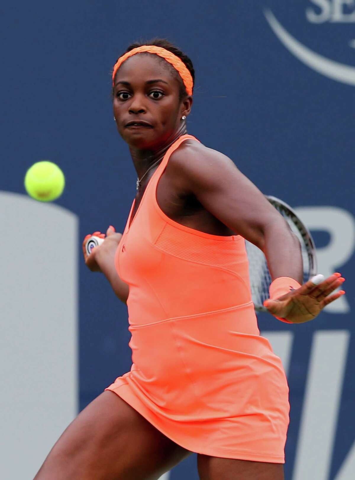 NEW HAVEN, CT - AUGUST 19: Sloane Stephens of the USA returns a shot to Anna Schmiedlova of Slovakia during Day Two of the New Haven Open at the Connecticut Tennis Center at Yale on August 19, 2013 in New Haven, Connecticut.