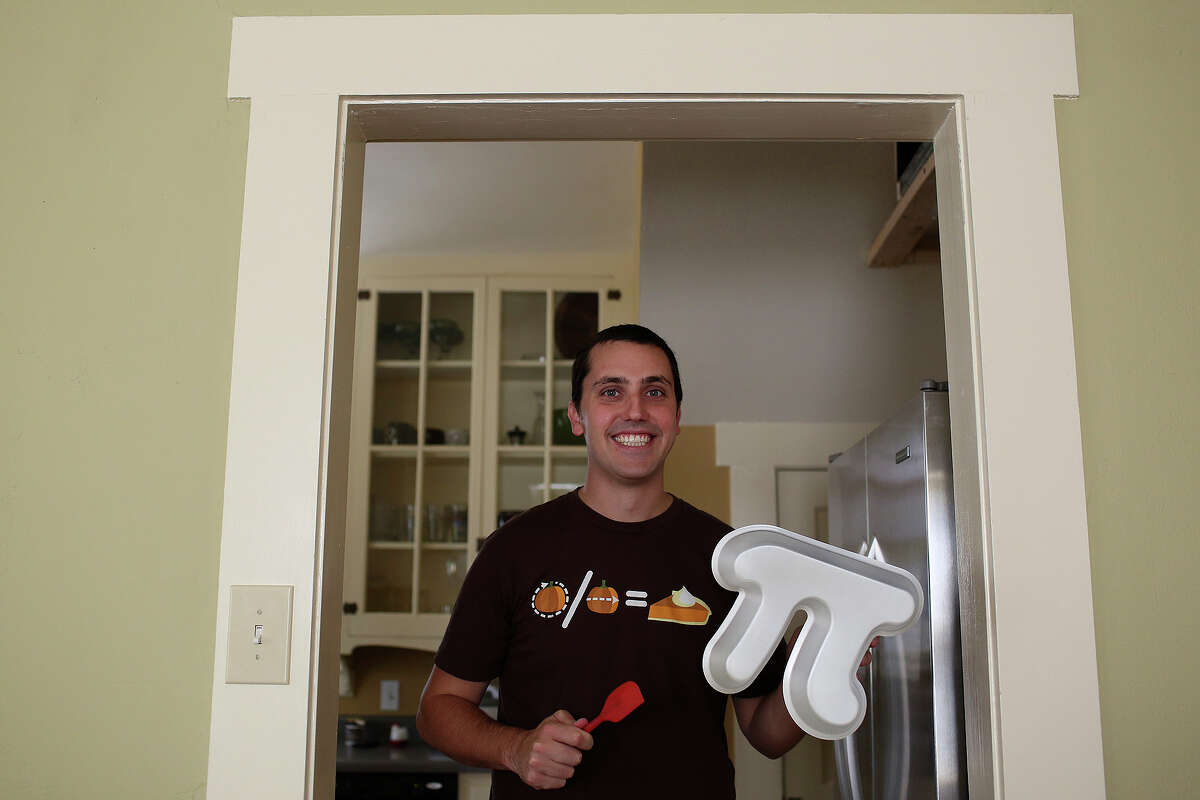 Garrett Heath holds a Pi Pan he created for making Pi shaped pies at his home San Antonio on Friday, August 16, 2013. He is raising money for the Pi Pans on Kickstarter with his project titled "Pi Pans: The Geekiest Way to Bake a Pie."