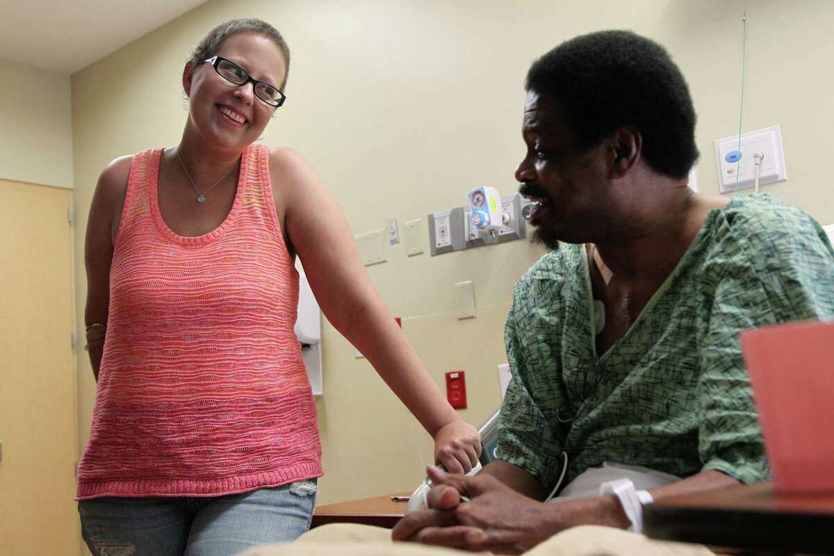 Organ recipient Tiffany Schwantes, 31, visits organ donor Vernon Roberson weeks after surgeons at Houston Methodist Hospital performed a "domino" transplant on Thursday, Aug. 15, 2013, in Houston. The "domino" transplant is a procedure that's done on two people at the same time. Roberson, who suffered from with amyloidosis (a blood disease that attacks and damages the heart, liver, and other organs) needed a heart and liver transplant. Schwantes has bile duct cancer and was going to die without a liver transplant. They transplanted Roberson's heart, took out his liver, and implanted it into Schwantes. Even though the liver was diseased with amyloidosis, it saved her life. Schwantes was so far down on the transplant list that she never would have survived without it. Doctors said it will take her 25 to 30 years to develop amyloidosis, and in that time, she can receive a new liver. ( Mayra Beltran / Houston Chronicle )