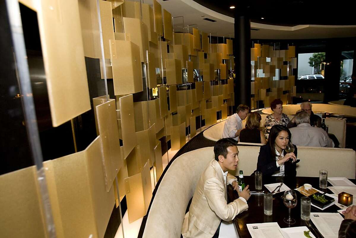 Howard Cheng and Lada Eng dine in the circular shaped dining room at 5A5 Steak Lounge in San Francisco, Calif., on Tuesday, June 30, 2009.