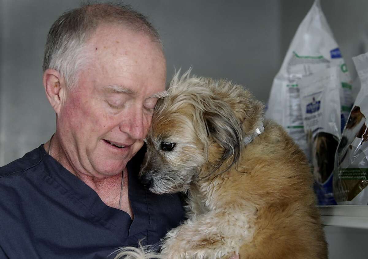 Don Conkling cuddles with his dog Sophie in San Bruno, Calif. on Tuesday, Aug. 20, 2013. Conkling, who has been living with high blood pressure for over 10 years, has been able to keep it under control by working closely with his physicians and by making changes to his diet and exercise routine.