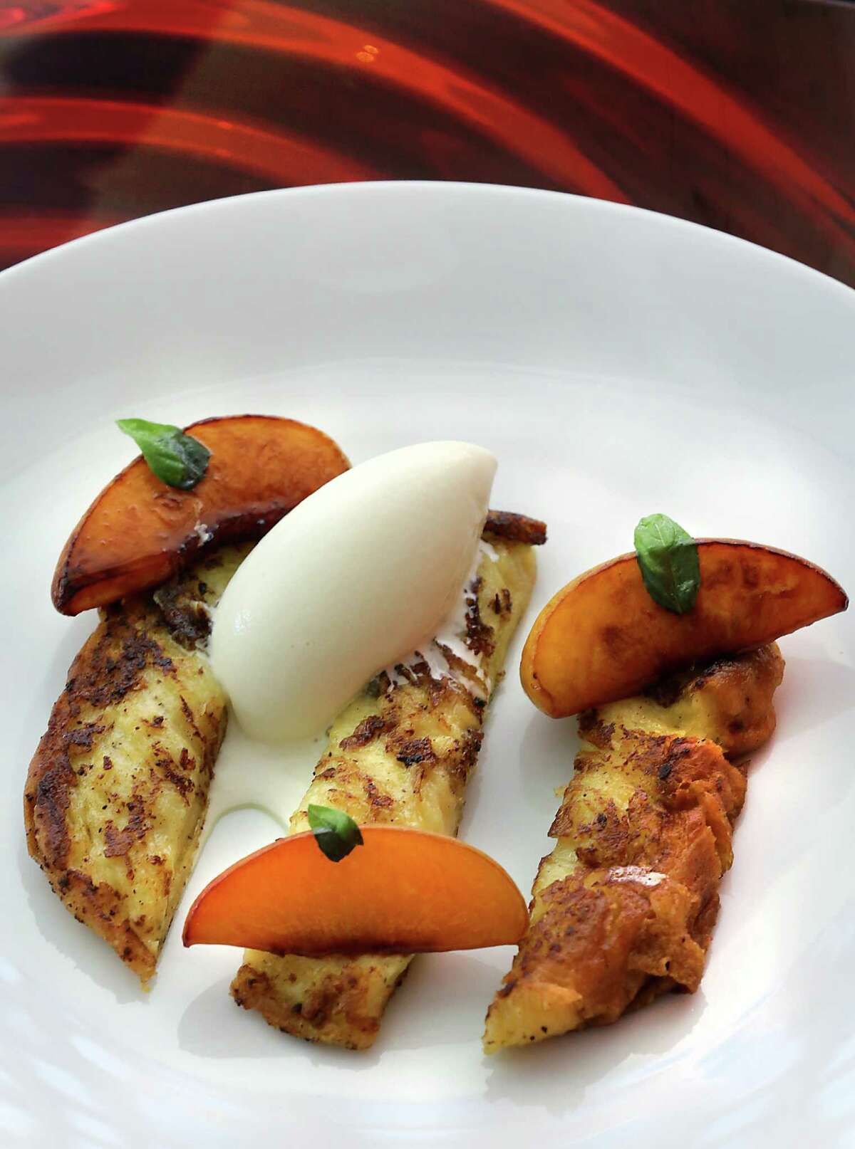 Brioche French Toast with Honey Roasted Peaches and Basil Ice Cream at Saveurs 209