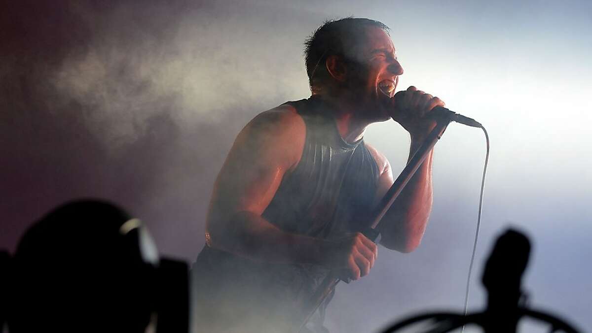 Trent Reznor of Nine Inch Nails. CHICAGO, IL - AUGUST 02: Trent Reznor of Nine Inch Nails performs during Lollapalooza 2013 at Grant Park on August 2, 2013 in Chicago, Illinois. (Photo by Theo Wargo/Getty Images)