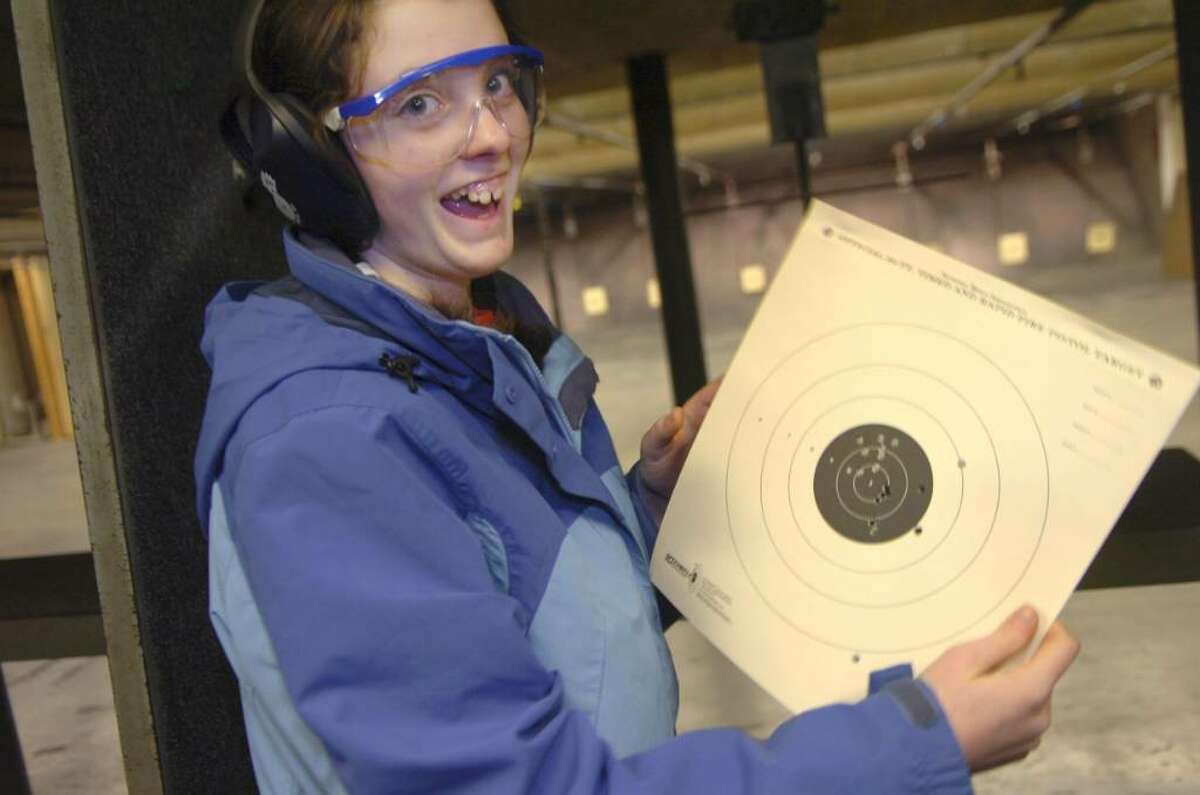 Greenwich, Jan. 10, 2010. Kelly Martise, 14, from the "High School Troup", celebrates her success at the target practice with 22 caliber rifles at the Cos Cob Revolver and Rifle Club, one of the Troup's events.