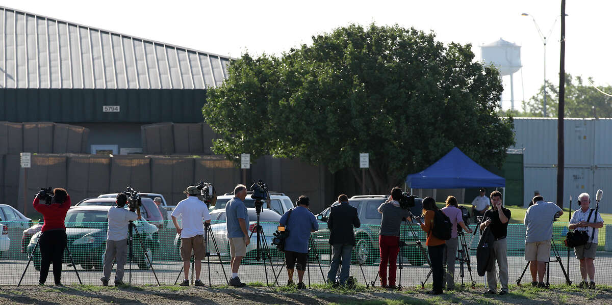 Media members gets a closer view of the heavily fortified M.G. Williams Judicial Center on the first day of the capital murder trial of U.S. Army Lt. Nidal Malik Hasan at Fort Hood, Tuesday, August 6, 2013. Hasan is facing 13 counts of premeditated murder and 32 counts of attempted premeditated murder in the shooting rampage at Fort Hood on Nov. 5, 2009.