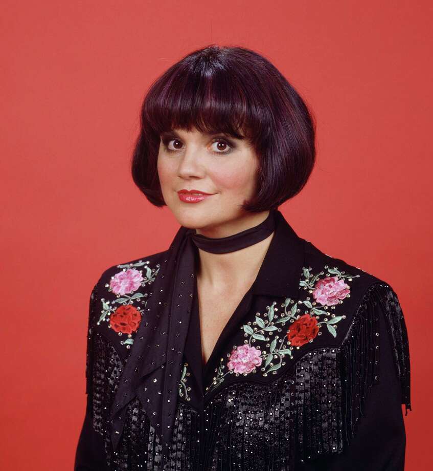 Promotional portrait of American singer Linda Ronstadt as she poses in an e...
