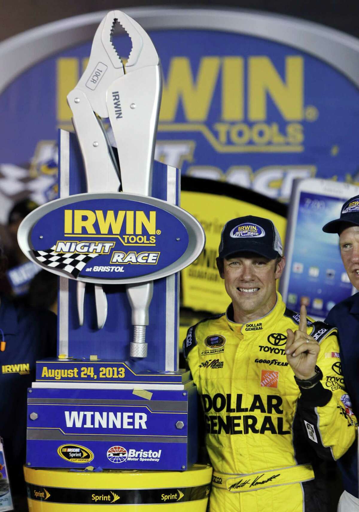 Matt Kenseth enjoys the moment with the trophy in Victory Lane after his Sprint Cup victory Saturday night at Bristol Motor Speedway.