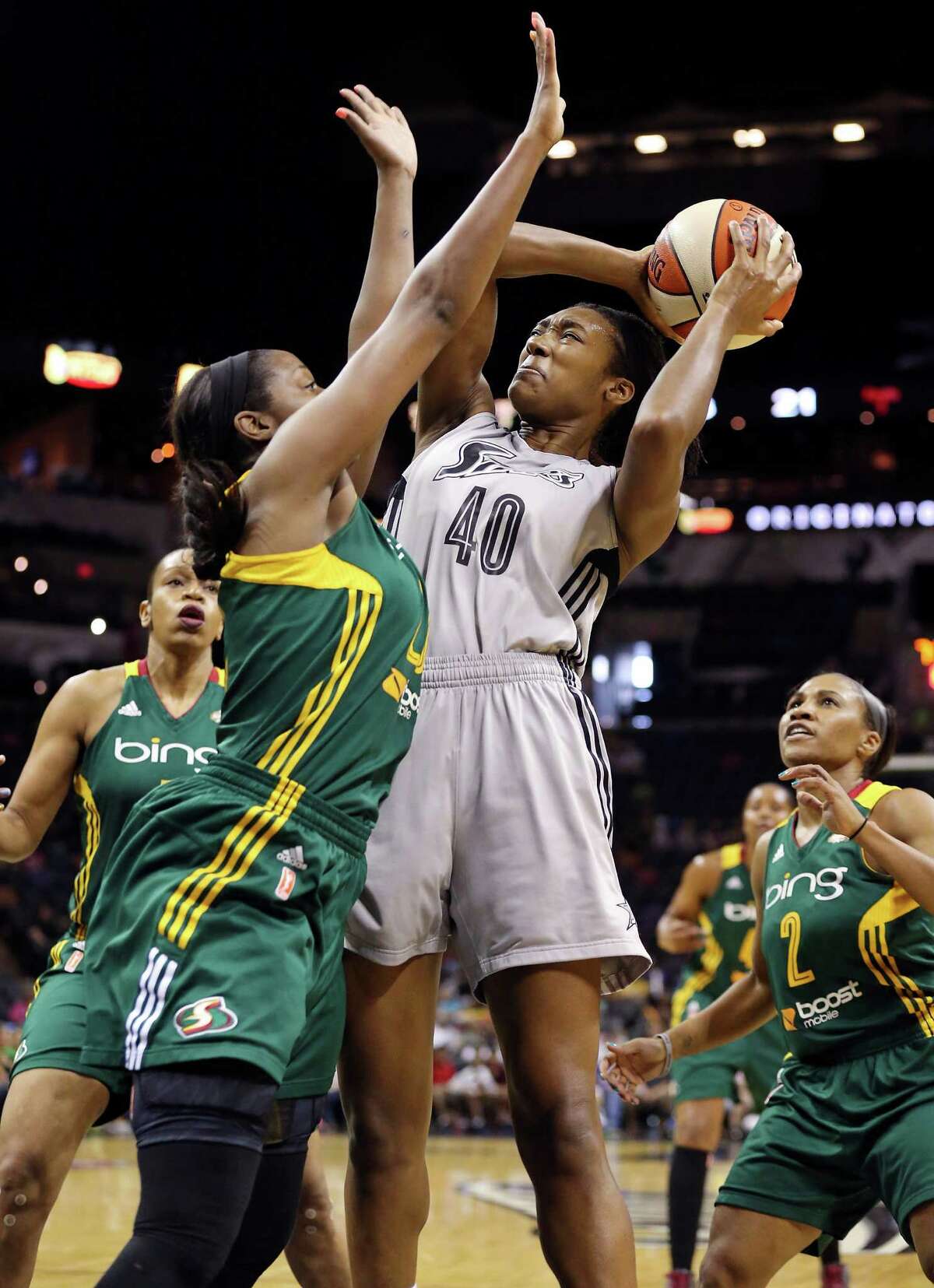 Silver Stars' Kayla Alexander drives to the basket against Seattle Storm's Camille Little during first half action Sunday Aug. 25, 2013 at the AT&T Center.