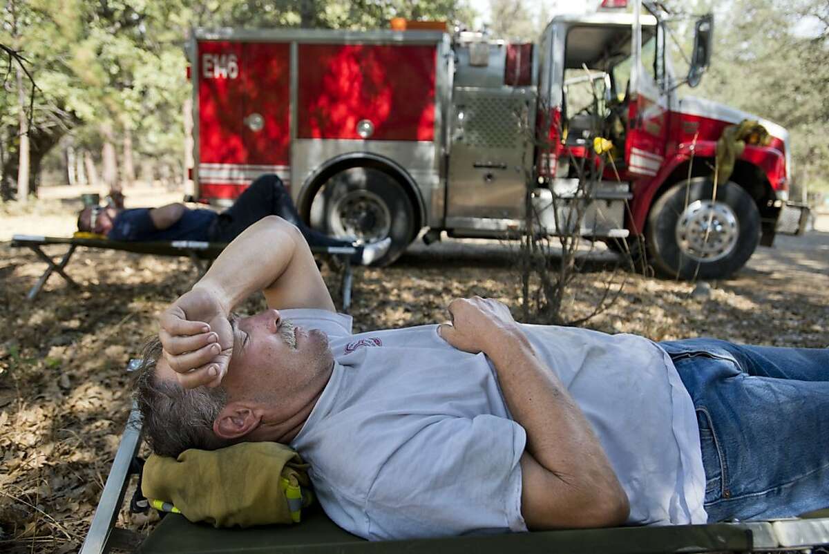 Sacramento River Fire District Captain Jerry Winters, 61, rests at base camp before the start of the night shift with Engineer Scott Stanfield fighting the Rim Fire in the Stanislaus National Forest along Highway 120 near Yosemite National Park, California, Monday, August 26, 2013. (Paul Kitagaki Jr./Sacramento Bee/MCT)