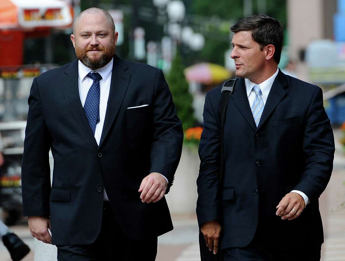 Robert Braddock Jr., former aide to ex-Connecticut House Speaker Christopher Donovan, left, arrives with his attorney Frank Riccio II, at federal court to be sentenced in New Haven, Conn., Tuesday, Aug. 27, 2013. Braddock was found guilty in May of campaign finance and conspiracy charges. (AP Photo/Jessica Hill)