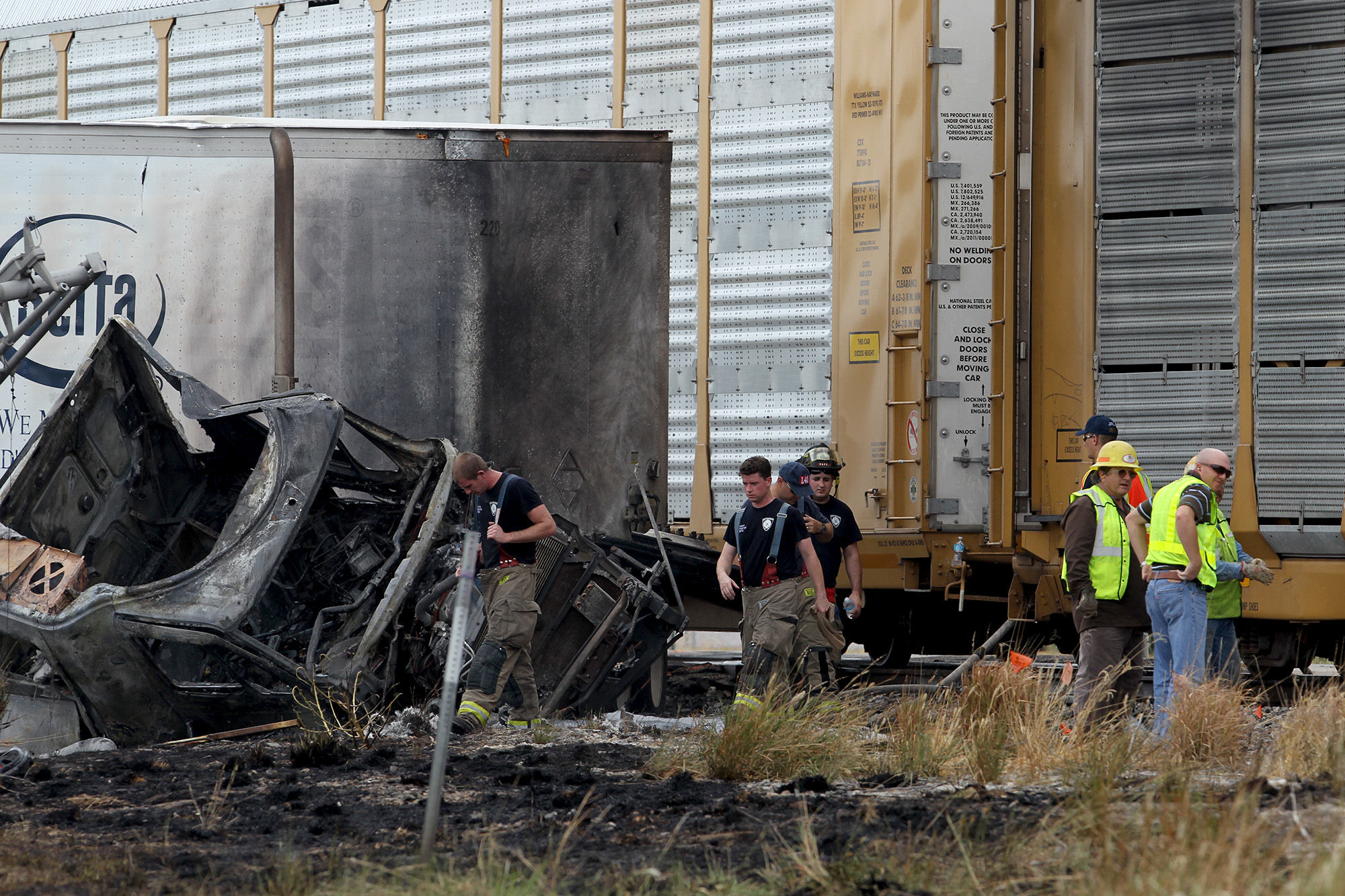 Truck stalled on tracks gets hit by train