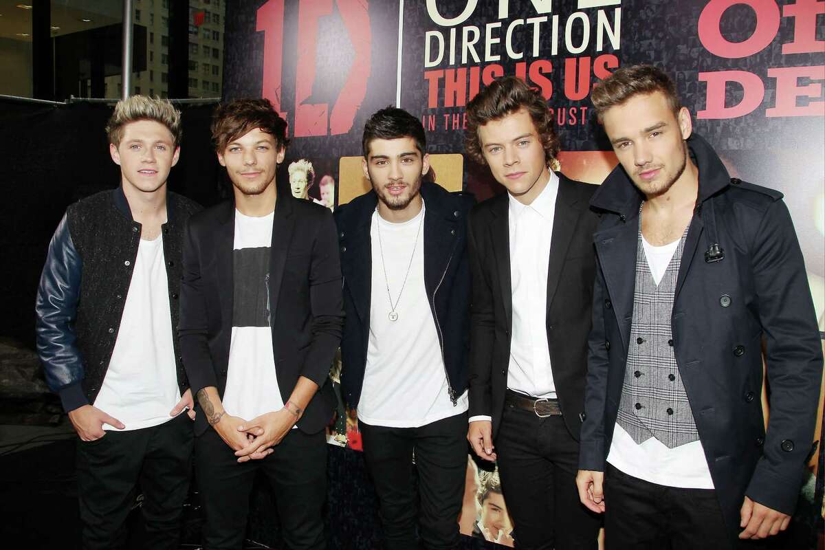 This image released by Starpix shows members of One Direction, from left, Niall Horan, Louis Tomlinson, Zayn Malik, Harry Styles, and Liam Payne at the premiere of the film "One Direction:This Is Us," at the Ziegfeld Theatre in New York on Monday, Aug. 26, 2013. (AP Photo/Starpix, Dave Allocca) ORG XMIT: NYET100