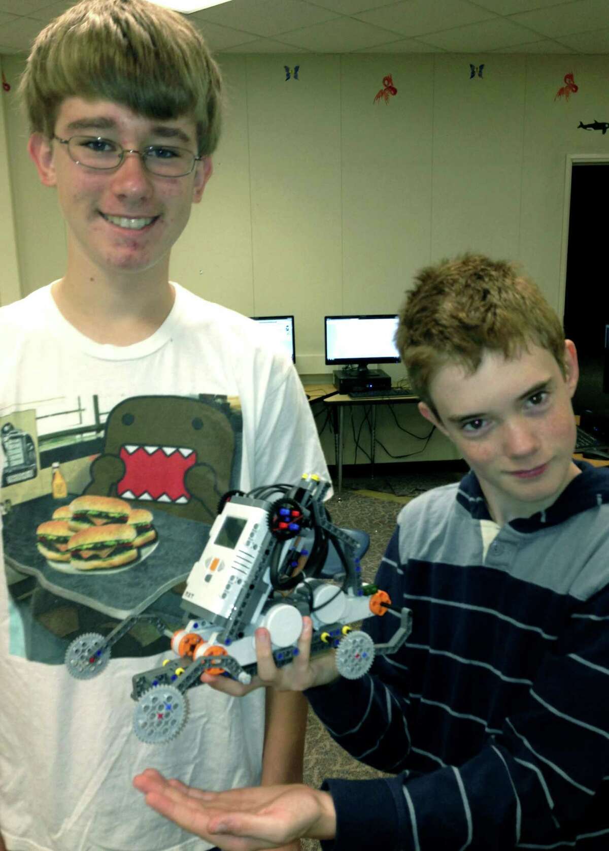 Jack Virbickas, left, and Thomas Bachelier proudly display what they've created with their robotics work in the Shepaug summer enrichment program. July 2013 Courtesy of Sheila Gambino