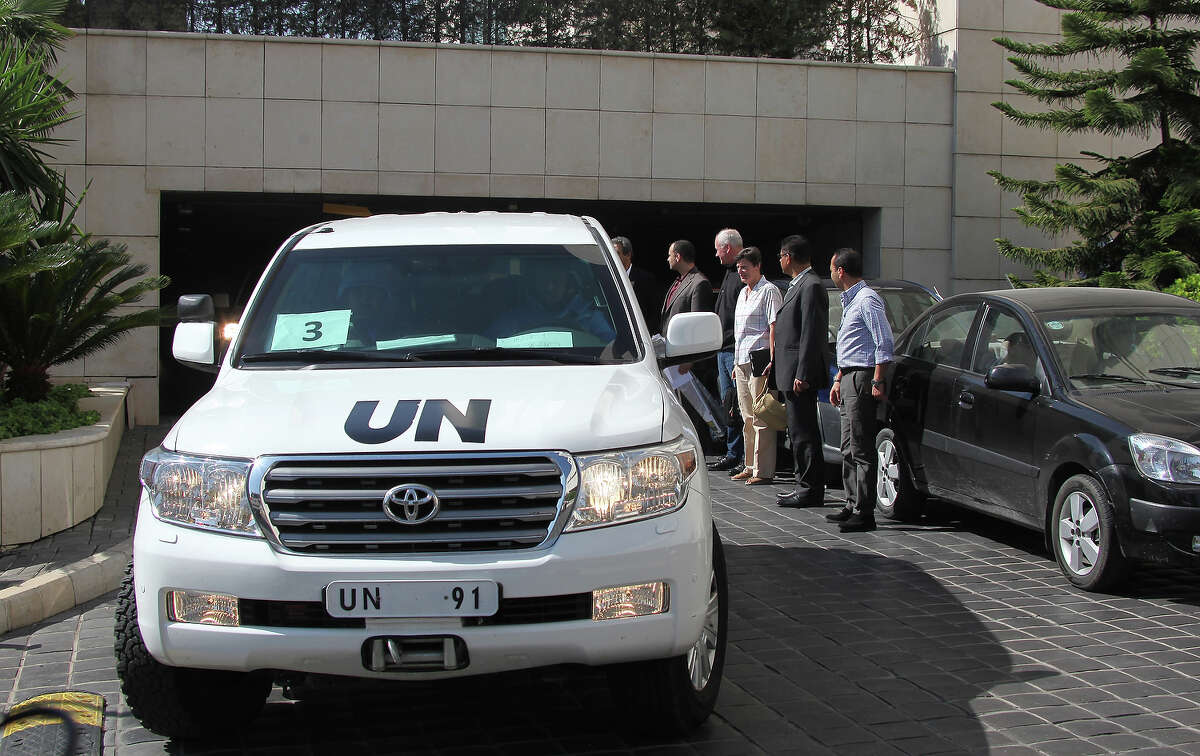 A convoy of United Nations (UN) vehicles leave a hotel in Damascus on August 28, 2013 carrying UN inspectors travelling to a site in the Syrian capital of alleged chemical weapons attacks, a day after suspending their mission over safety concerns. The team of arms experts boarded a convoy of six vehicles, but it was unclear which site they were intending to visit after braving sniper fire two days ago when they began their mission by visiting two field hospitals in Moadamiyet al-Sham, southwest of Damascus, where they collected evidence of last week's suspected chemical attacks.