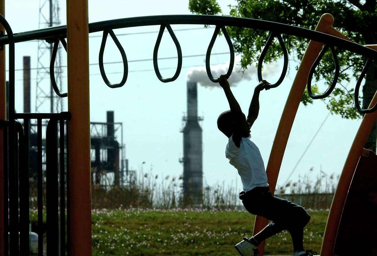 Korwin Thomas plays on the playground on West 15th in Port Arthur in 2011. Enterprise file photo.