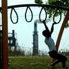 Korwin Thomas plays on the playground on West 15th in Port Arthur in 2011. Enterprise file photo.