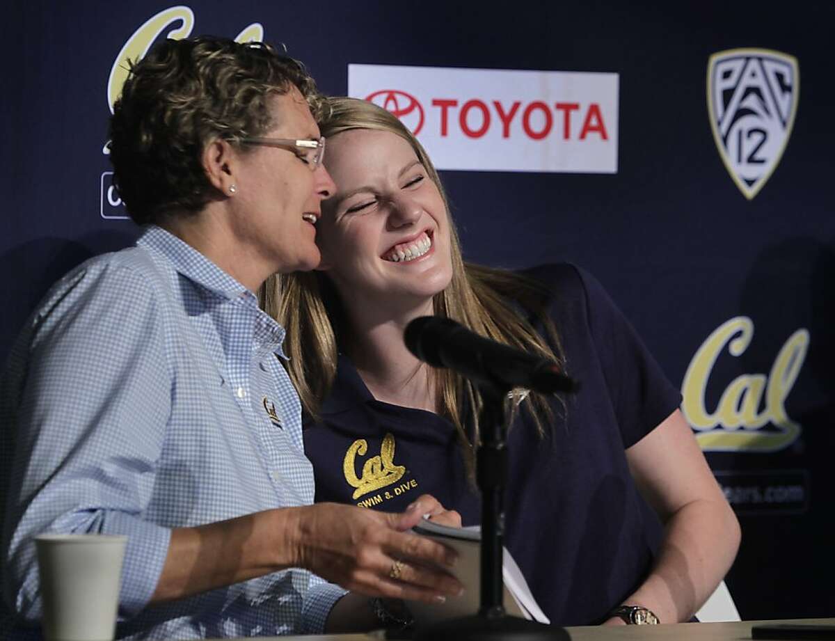 Swimmer Missy Franklin nuzzles up to her coach Teri McKeever (left) after meeting with sportswriters at UC Berkeley on Wednesday, Aug. 28, 2013. Franklin, who took home gold medals in several swimming events at the London Olympic Games in 2012, starts her freshman year at Cal this week.
