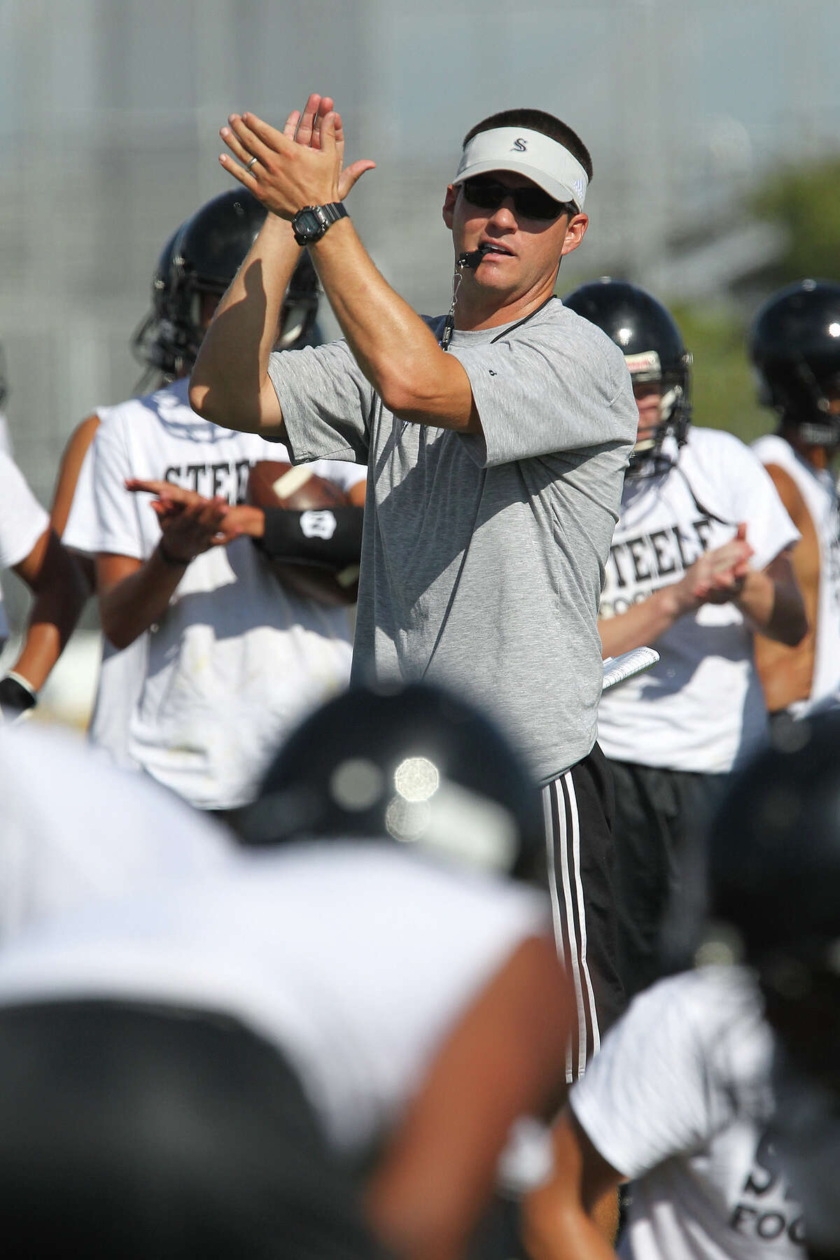Steele High School Head Football Coach Scott Lehnhoff goes through the team's first practice of the season, Monday, Aug. 12, 2013. Lehnhoff took over the team after Mike Jinks left for Texas Tech University. The Knights have a 43-4 record in the past three years.