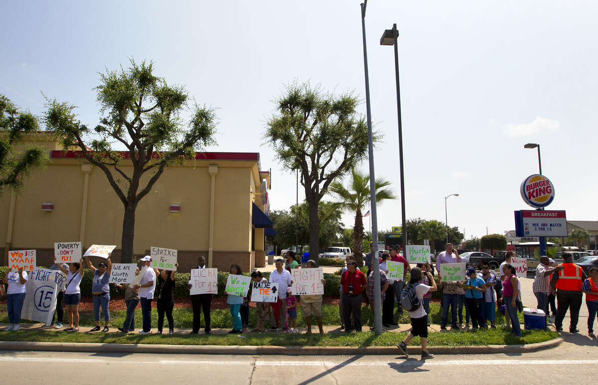 Demonstrators stand in front of a Burger King in Houston on a day of wage protests nationwide.