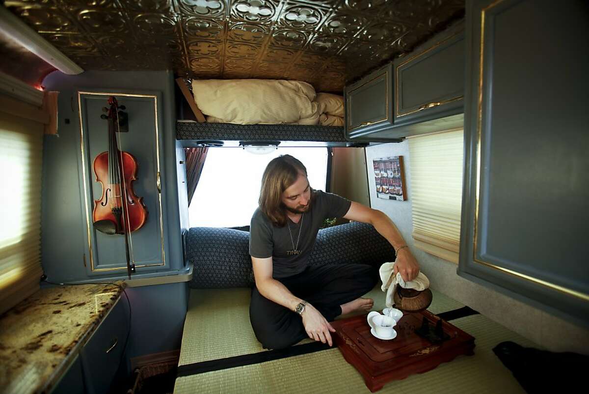 SETT co-founder Tynan pours tea in his RV on Tuesday, July 2, 2013 in San Francisco, Calif.