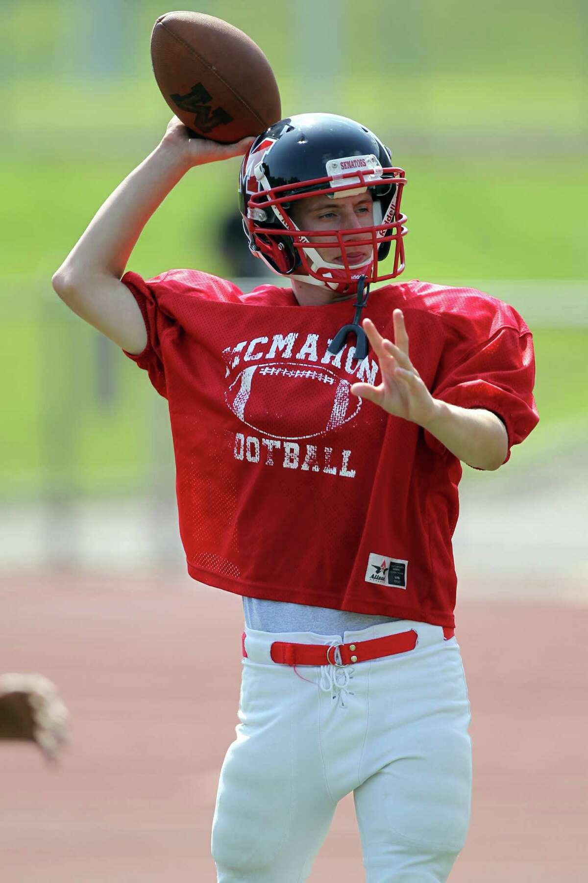 Brien McMahon quarterback Matt Downey tosses the football during practice on Friday Aug. 30, 2013.