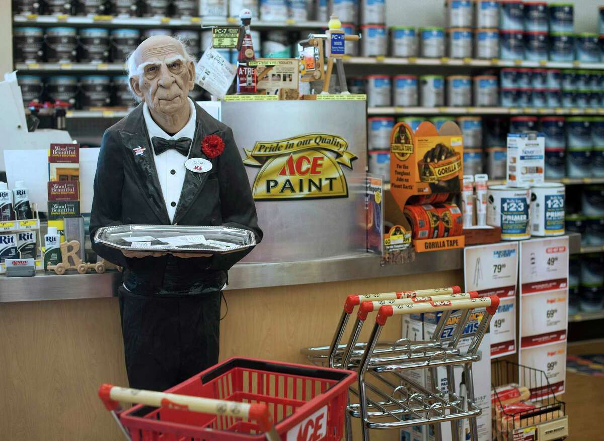 A statue of an Ace butler is in the paint department at a Renco Ace Hardware store in Bloomsburg, Pa. U.S. consumer spending showed weak growth in July.