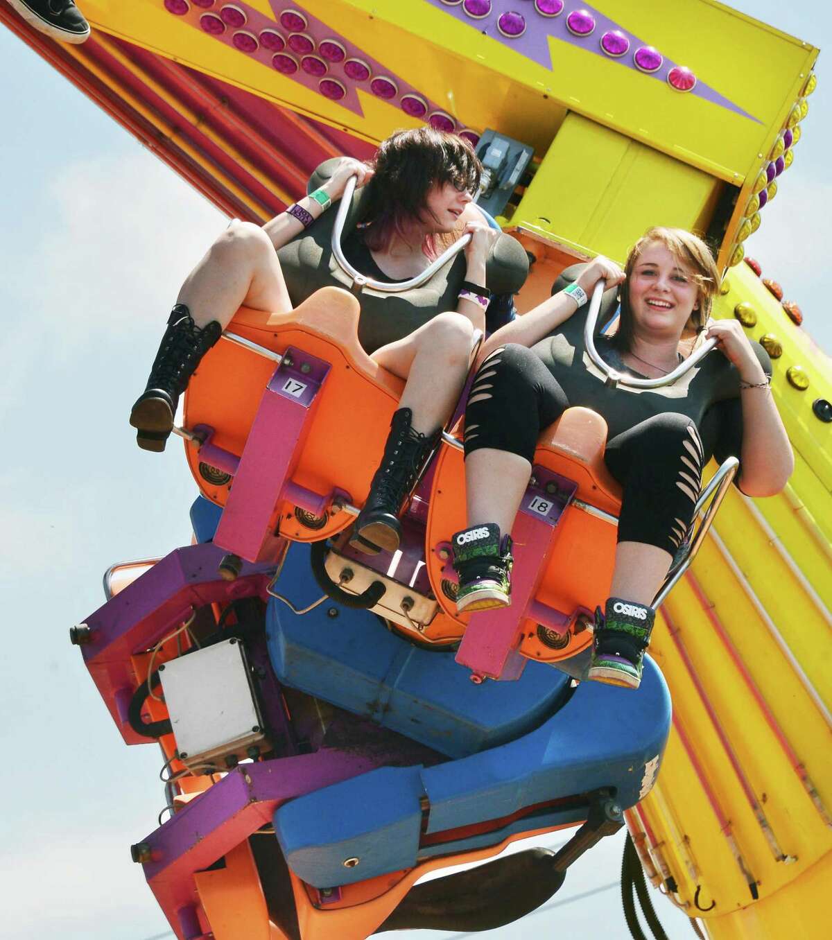 Paige Marie, 16, left, and Allyssa Daniels, 18, both of West Burke, Vt., ride the Power Surge at the Schaghticoke Fair Friday Aug. 30, 2013, in Schaghticoke, NY. (John Carl D'Annibale / Times Union)