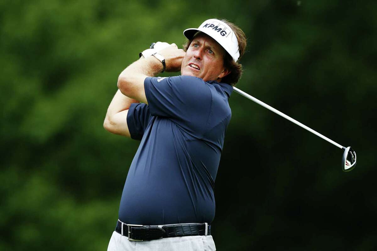 Phil Mickelson, watching his tee shot at No. 4, briefly had a shot at a 59 before settling for a 63.