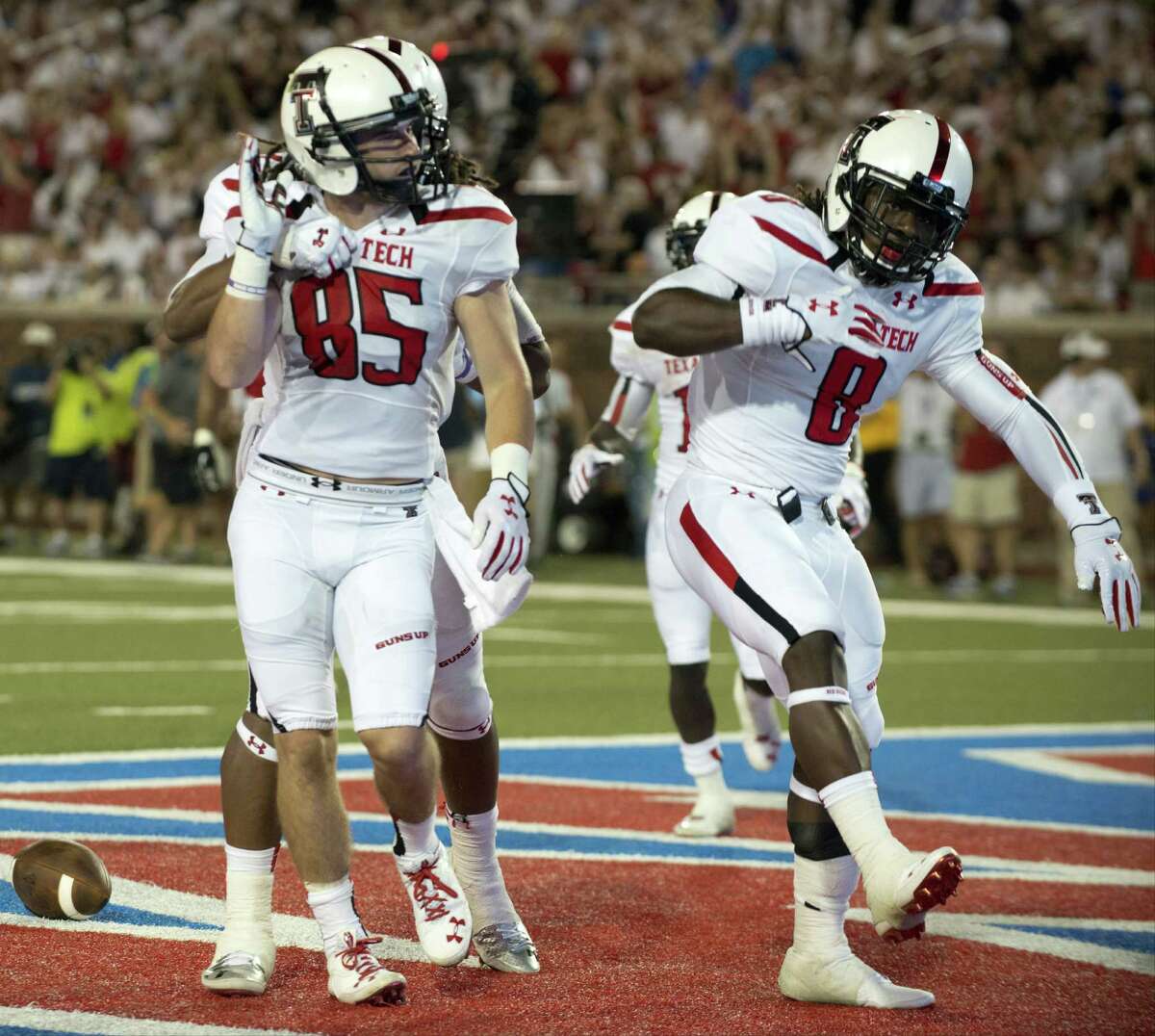 DALLAS, TX - AUGUST 30: Jordan Davis #85 of the Texas Tech Red Raiders celebrates with teammates after scoring a touchdown against the Southern Methodist Mustangs on August 30, 2013 at Gerald J. Ford Stadium in Dallas, Texas. (Photo by Cooper Neill/Getty Images)