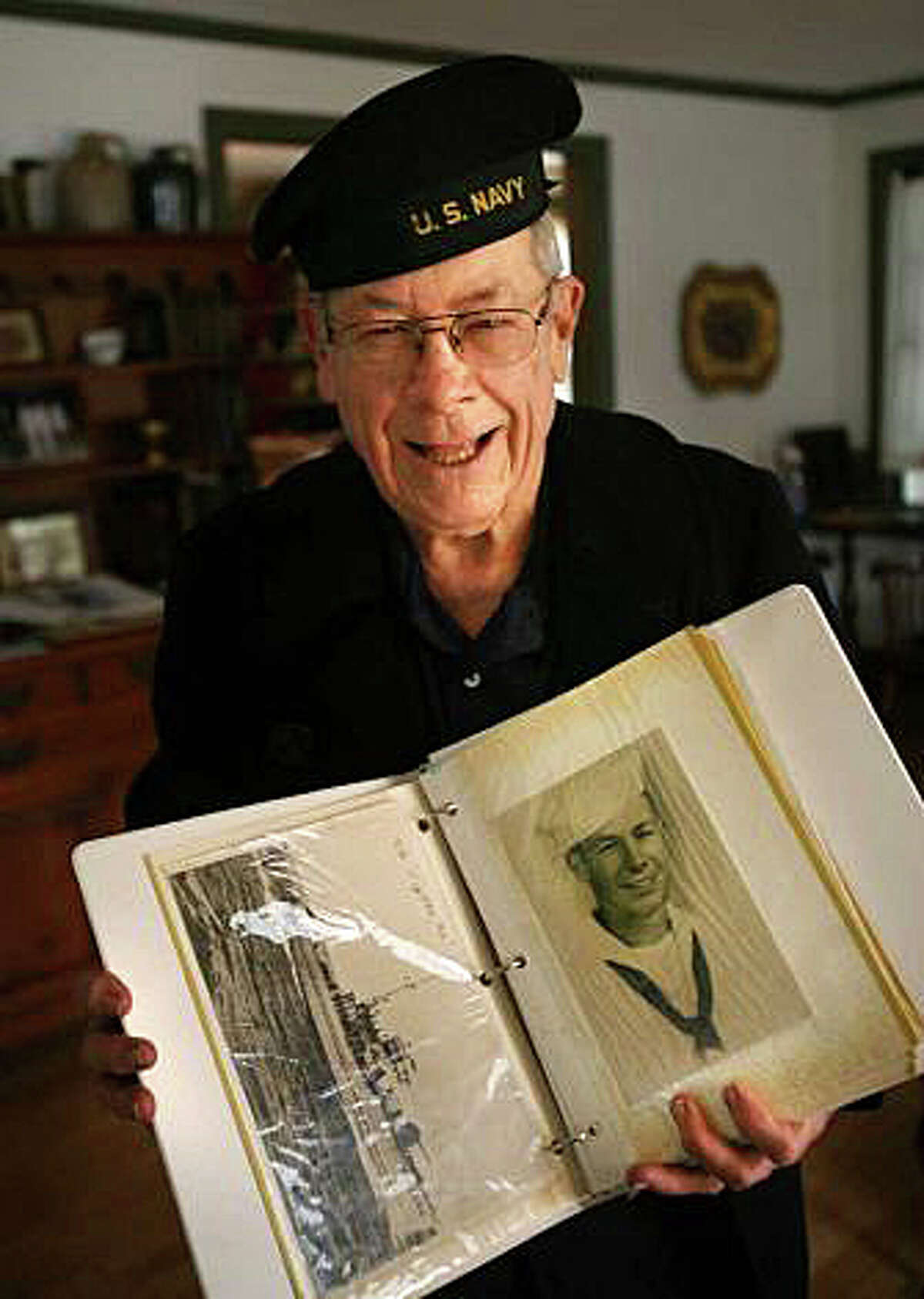 World War II veteran and former Fire Chief Dave Russell holds a picture of his ship, the PCS 1392 patrol craft, which served as a deterrent to attacks by German U-Boats in the Atlantic. Russell joined the Navy at the age of 17 and served from 1944 through 1946. FAIRFIELD CITIZEN, CT 8/31/13