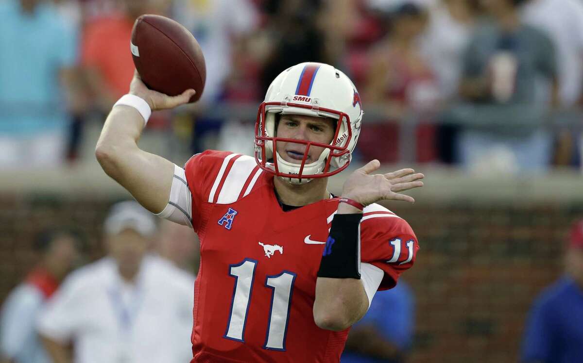 Southern Methodist quarterback Garrett Gilbert (11) passes during the first half of an NCAA college football game against Texas Tech, Friday, Aug. 30, 2013, in Dallas. (AP Photo/LM Otero)