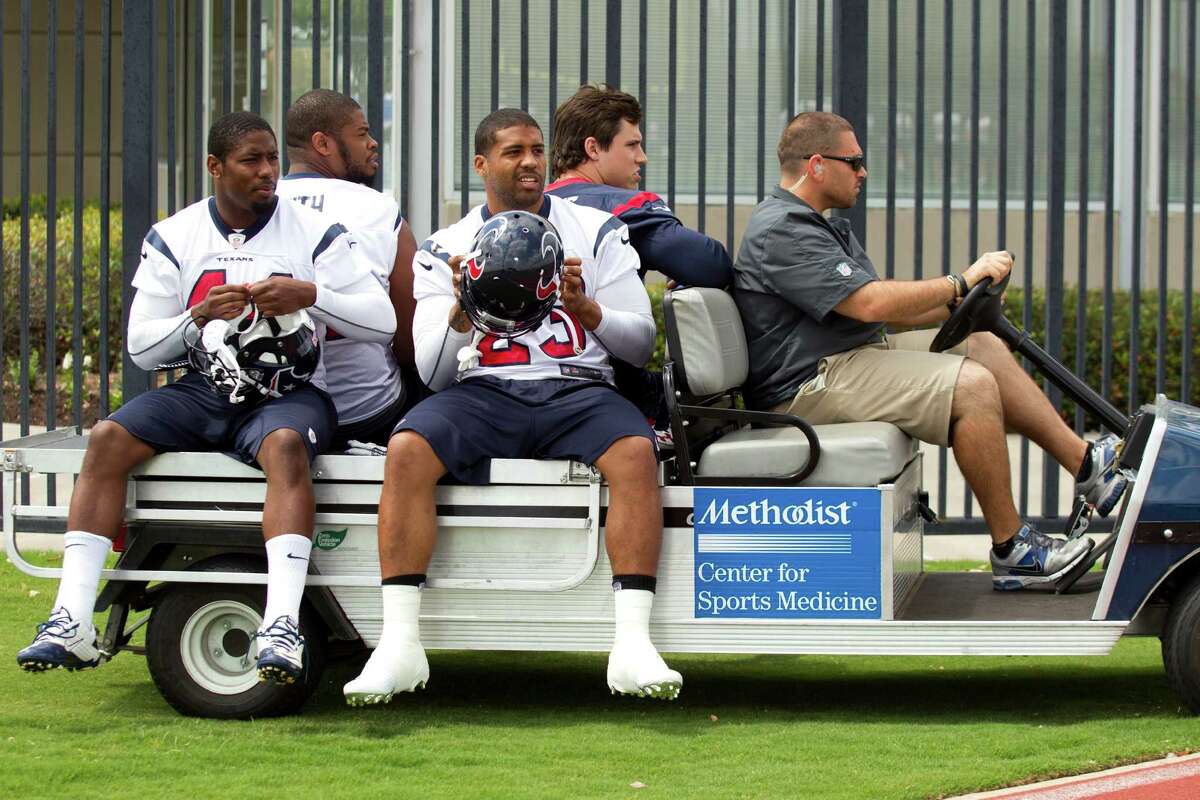 Houston Texans Ben Tate (44), Arian Foster (23) Wade Smith and Brian Cushing take a ride to practice during Texans' Organized Team Activities at the Methodist Training Center Monday, May 20, 2013, in Houston.