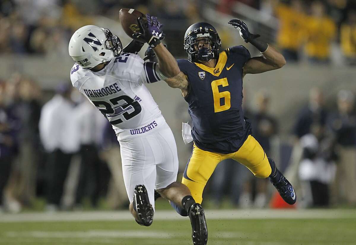 Northwestern's Nick VanHoose, (23) breaks up a pass to Cal's Chris Harper, (6) in the first quarter, as the Cal Berkeley Golden Bears take on the Northwestern Wildcats at Memorial stadium in Berkeley , Calif. on Saturday August 31, 2013.