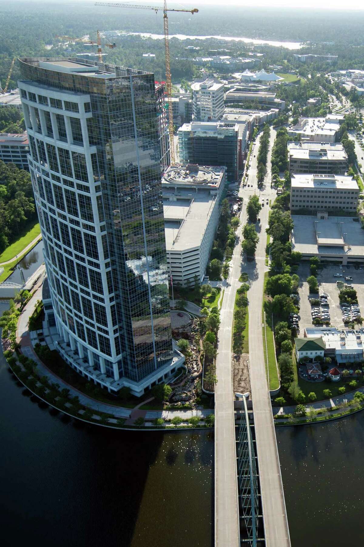 With developments such as the Anadarko Tower, above, and Exxon-Mobil's new campus, The Woodlands is maturing into a big city, with all the problems that accompany growth.