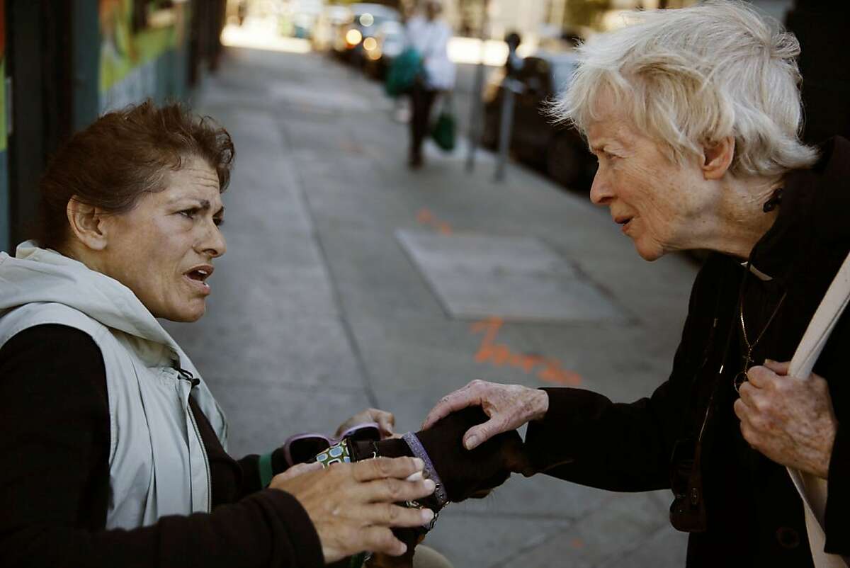Rev. Glenda Hope (right) talks with Maria (left) on the corner of Turk and Larkin before praying with her on Wednesday, August 28, 2013 in San Francisco, Calif.