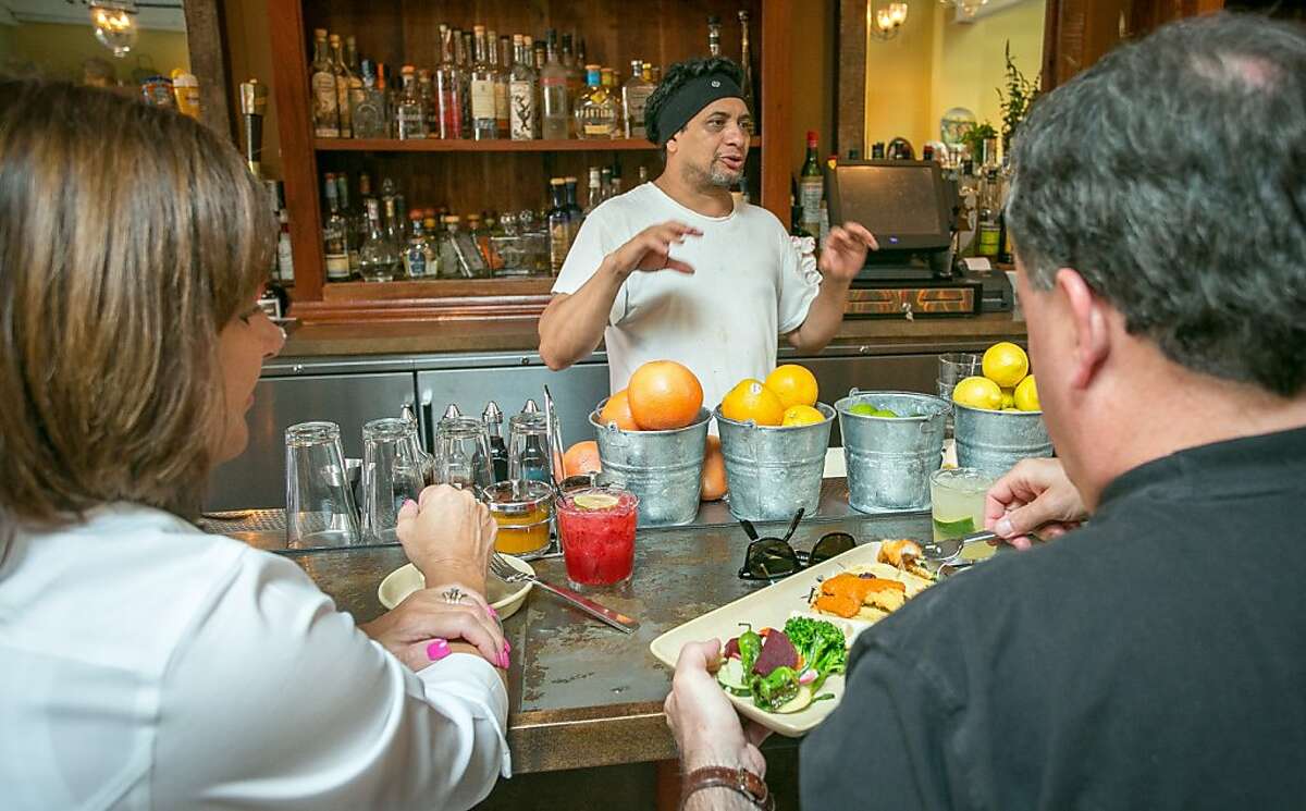 Chef Mateo Granados talks with customers at the bar at Mateo's Cocina Latina in Healdsburg, Calif., on Saturday, August 10th, 2013.