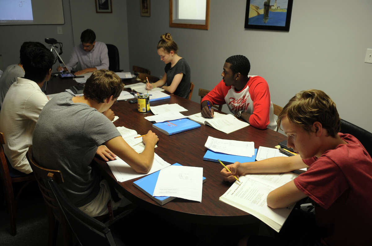 Young adults take a math class at First Choice College Placement in Milford on Tuesday September 3, 2013.