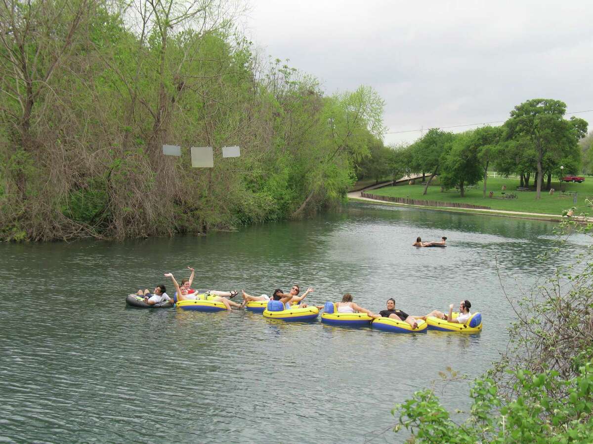 Staff photos by John W. Gonzalez, Houston Chronicle TUBERS 002 _ NEW BRAUNFELS _ Even on a cool spring afternoon, tubers floated along the Comal River on Thursday.