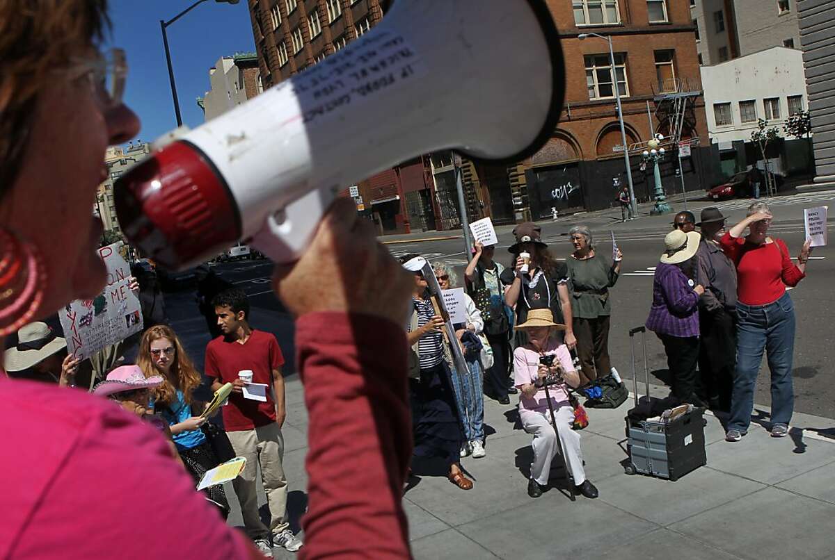 Janet Weil, left, of the San Francisco 99% Coalition and Code Pink makes a passionate speech to a crowd of protesters against Rep. Nancy Pelosi's support of President Obama's Syria policy at the Federal Building on September 4, 2013 in San Francisco, Calif.