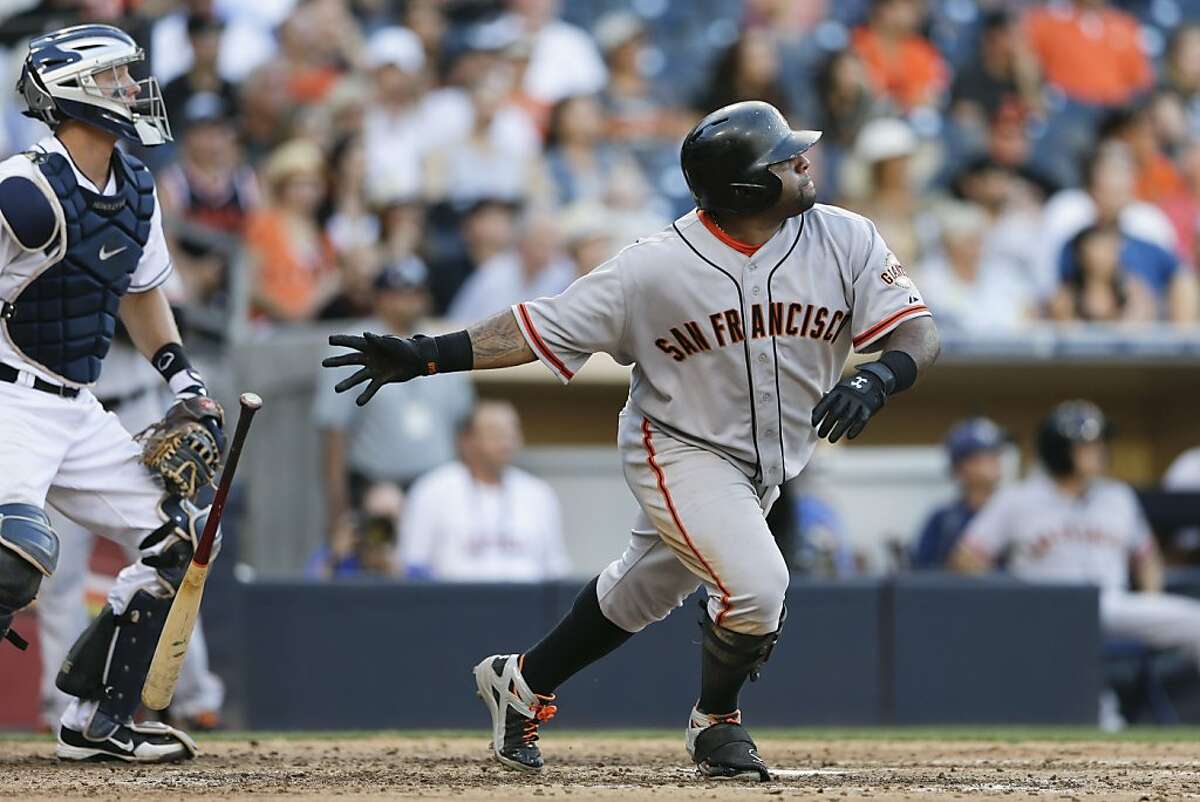 San Francisco Giants' Pablo Sandoval, right, watches his second home run of the game as San Diego Padres catcher Nick Hundley, left, looks on during the eighth inning of a baseball game o Wednesday, Sept. 4, 2013, in San Diego. (AP Photo/Gregory Bull)