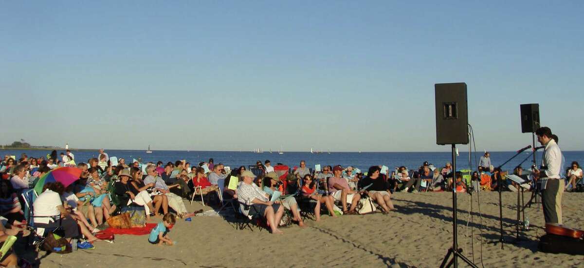 A crowd of several hundred came to Jennings Beach at sunset Wednesday to celebrate the start of Rosh Hashana in a service planned by Congregation B'nai Israel. FAIRFIELD CITIZEN, CT 9/4/13