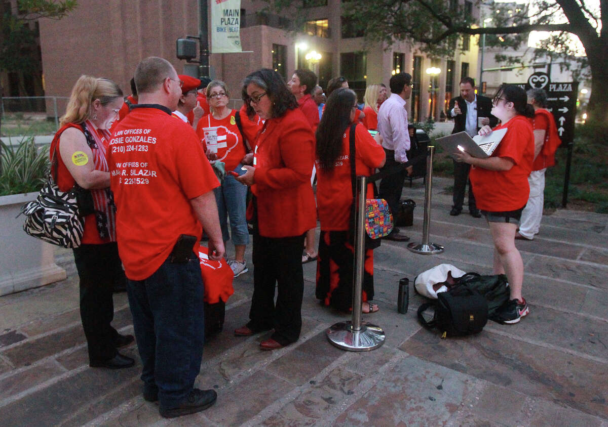 Citizens wearing red shirts and blue shirts line up Thursday September 5, 2013 in front of San Antonio City Council Chamber in anticipation of a vote by City Council on a proposed nondiscrimination ordinance that would add protections for sexual orientation, gender identity and veteran status to city code. Foes of the measure are wearing blue shirts, and proponents of the measure are wearing red.