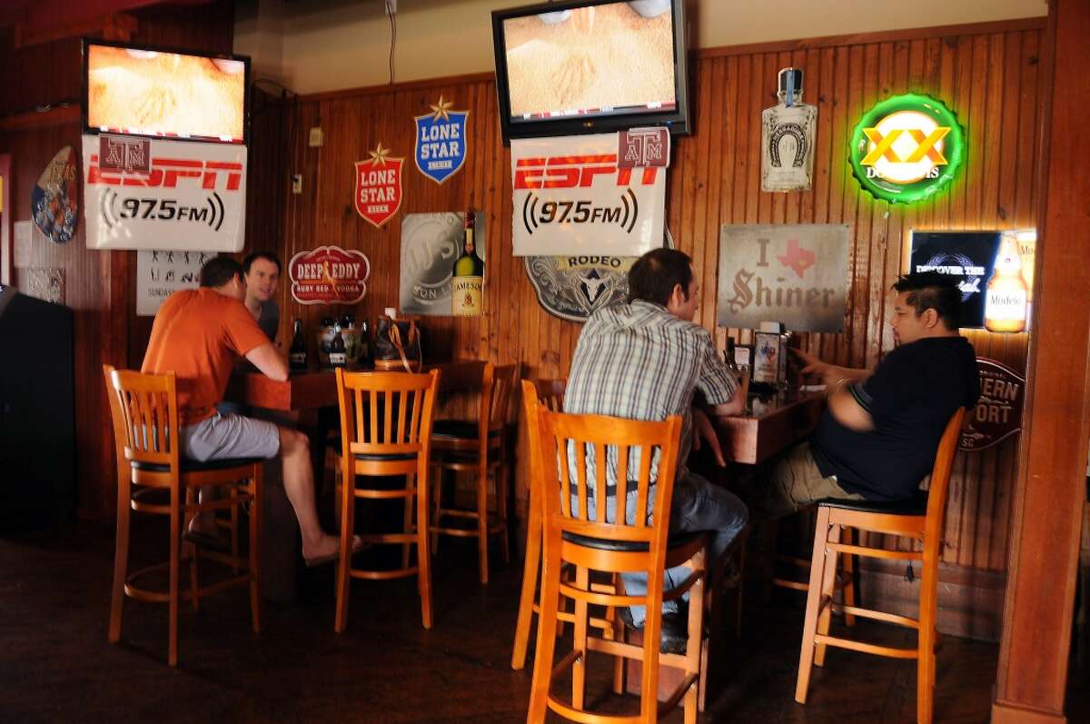 Fans watch college football games at Luke's Icehouse.