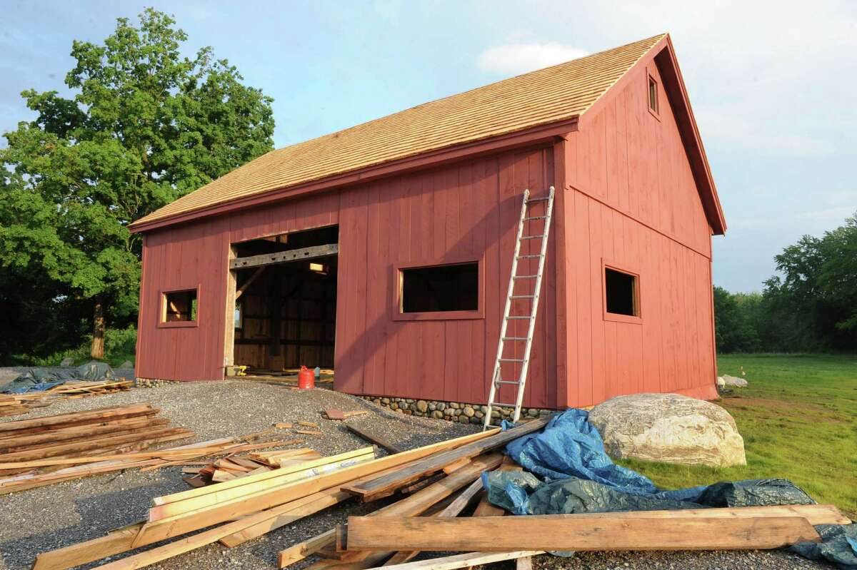 Exterior of Peter Brooks's barn on Tuesday, June 25, 2013 in Malta, N.Y. Wood has been installed in the 200-year-old barn which is being put together with original materials. (Lori Van Buren / Times Union)