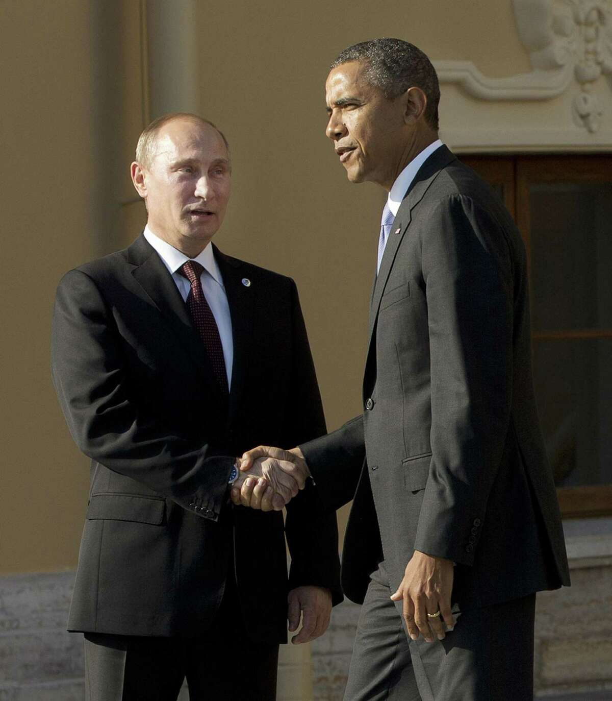 President Barack Obama tepidly shakes hands Thursday with Vladimir Putin as Obama arrived for the G-20 summit in St. Petersburg, Russia.