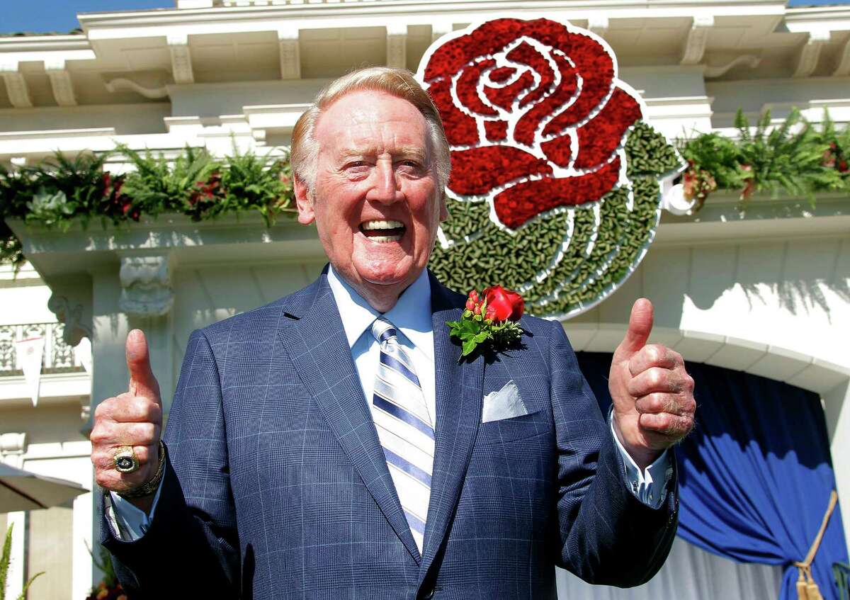 Hall of Fame broadcaster Vin Scully gives the thumbs up after being introduced as the grand marshall for 125th Tournament of Roses parade at Tournament House in Pasadena, Calif. on Thursday, Sept 5, 2013. Scully, will serve as grand marshal of the 125th Rose Parade on New Year's Day in Pasadena on Jan. 1, 2014. (AP Photo/Nick Ut)