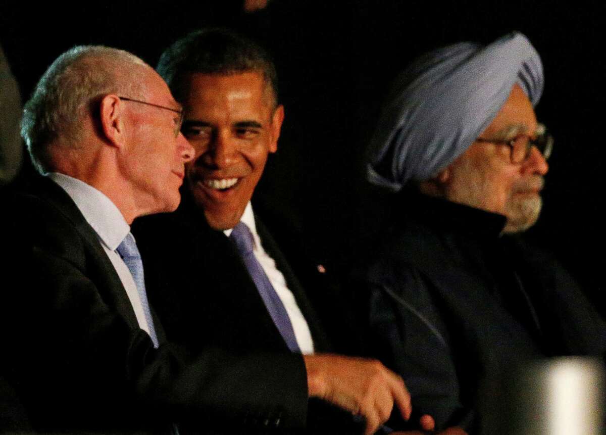 European Union Council President Herman Van Rompuy, left, and U.S. President Barack Obama, center, talk as India's Prime Minister Manmohan Singh watches the Water and Music Show during the G-20 summit at Peterhof Palace in St. Petersburg, Russia on early Friday, Sept. 6, 2013. The threat of missiles over the Mediterranean is weighing on world leaders meeting on the shores of the Baltic this week, and eclipsing economic battles that usually dominate when the G-20 world economies meet. (AP Photo/Alexander Zemlianichenko)